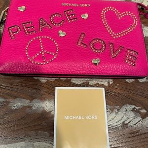 Hot pink Michael Kor’s wristlet